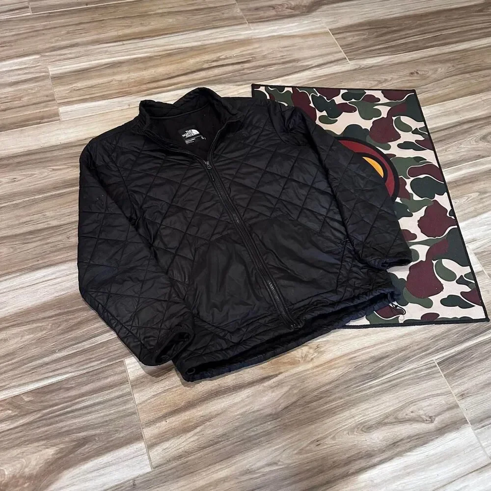 The North Face black quilted diamond pattern puffer jacket